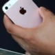 An-attendee-inpsects-the-new-iPhone-SE