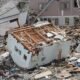 US_Navy_110315-N-2653B-107_An_upended_house_is_among_debris_in_Ofunato,_Japan,_following_a_9.0_magnitude_earthquake_and_subsequent_tsunami