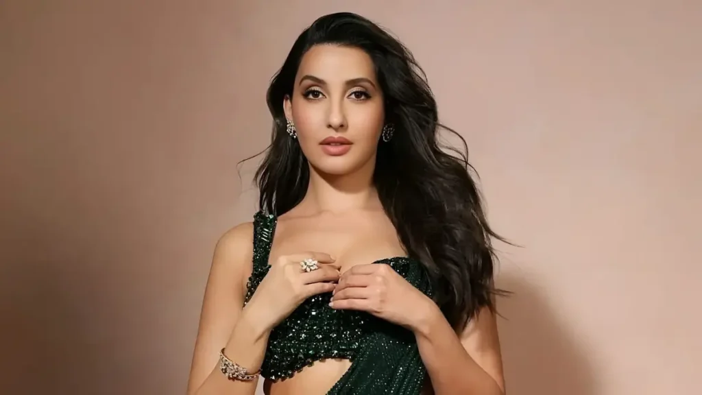 Singer Mangli ने माँगी माफी कहा "गलती अनजाने में हुई", Revised Song आज शाम Release होगा 32 Nora Fatehi ने 'Sarke Chunar Teri Sarke' विवाद पर पहली बार बोलते हुए कहा कि Hindi Version उनकी जानकारी के बिना बनाया गया और Sanjay Dutt के साथ उनका Poster AI Generated था।